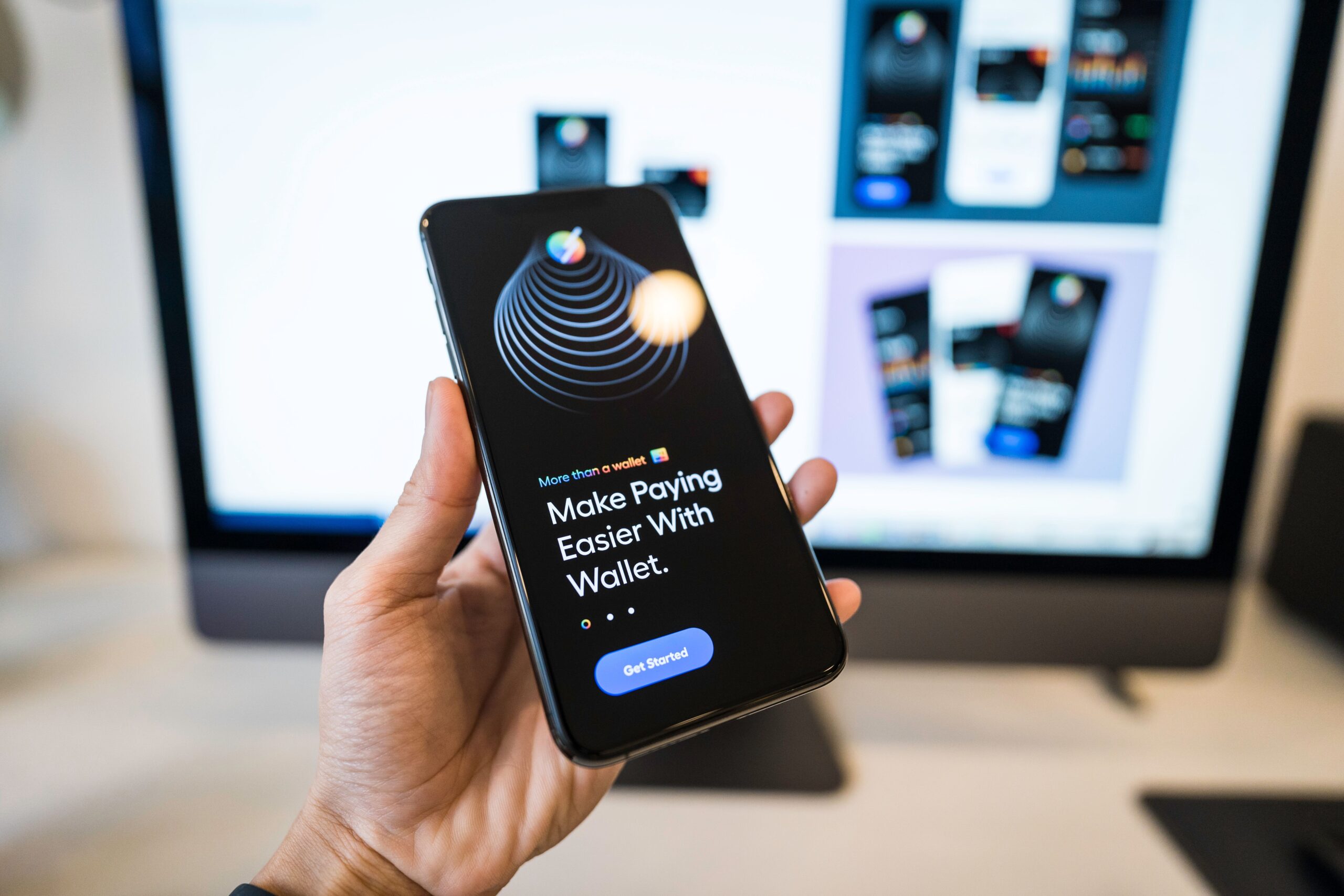 Illustrative close-up of a hand holding a smartphone showing a crypto wallet app, representing an airdrop wallet-connection prompt