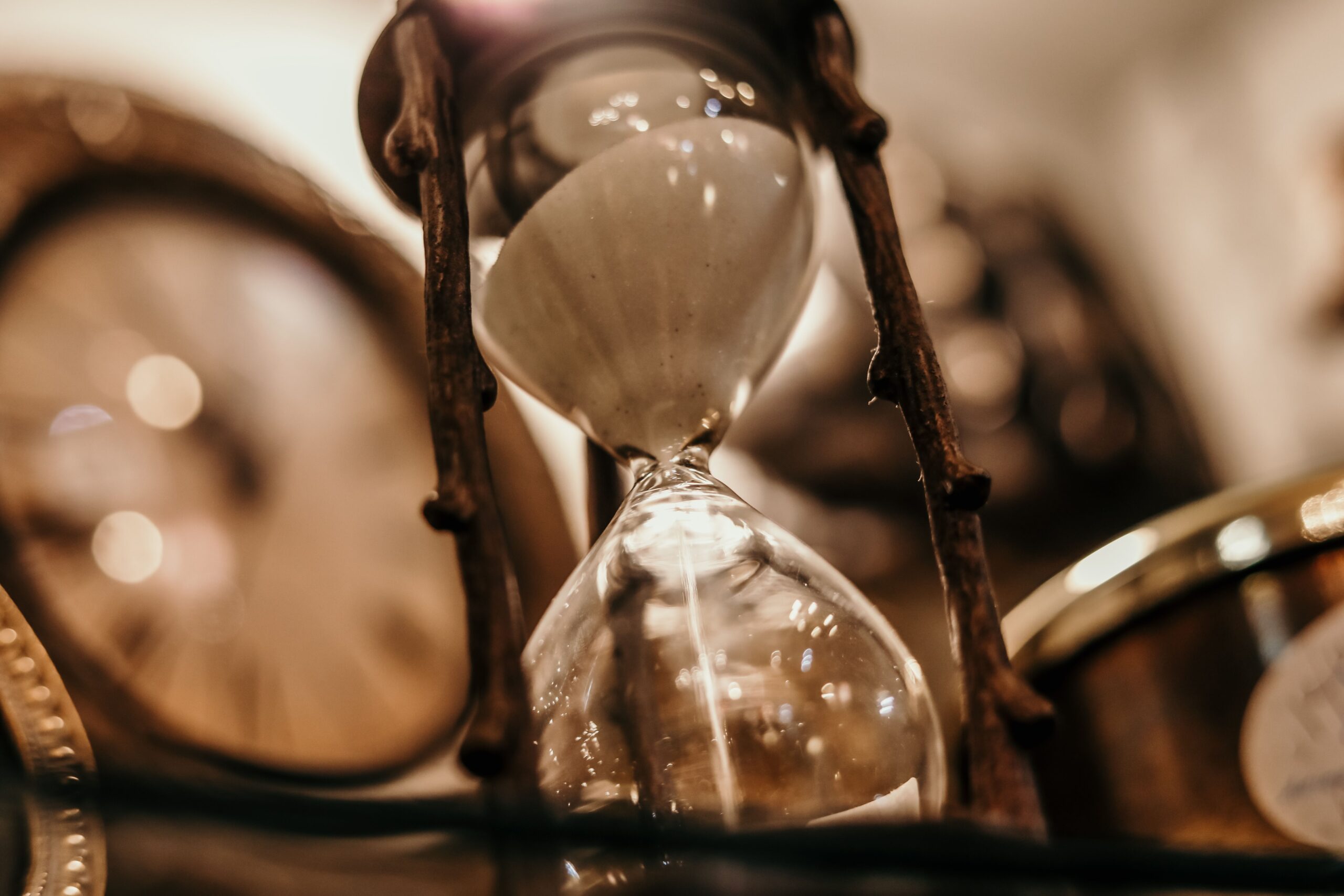 Illustrative close-up of an hourglass, representing the artificial urgency used in a token presale countdown