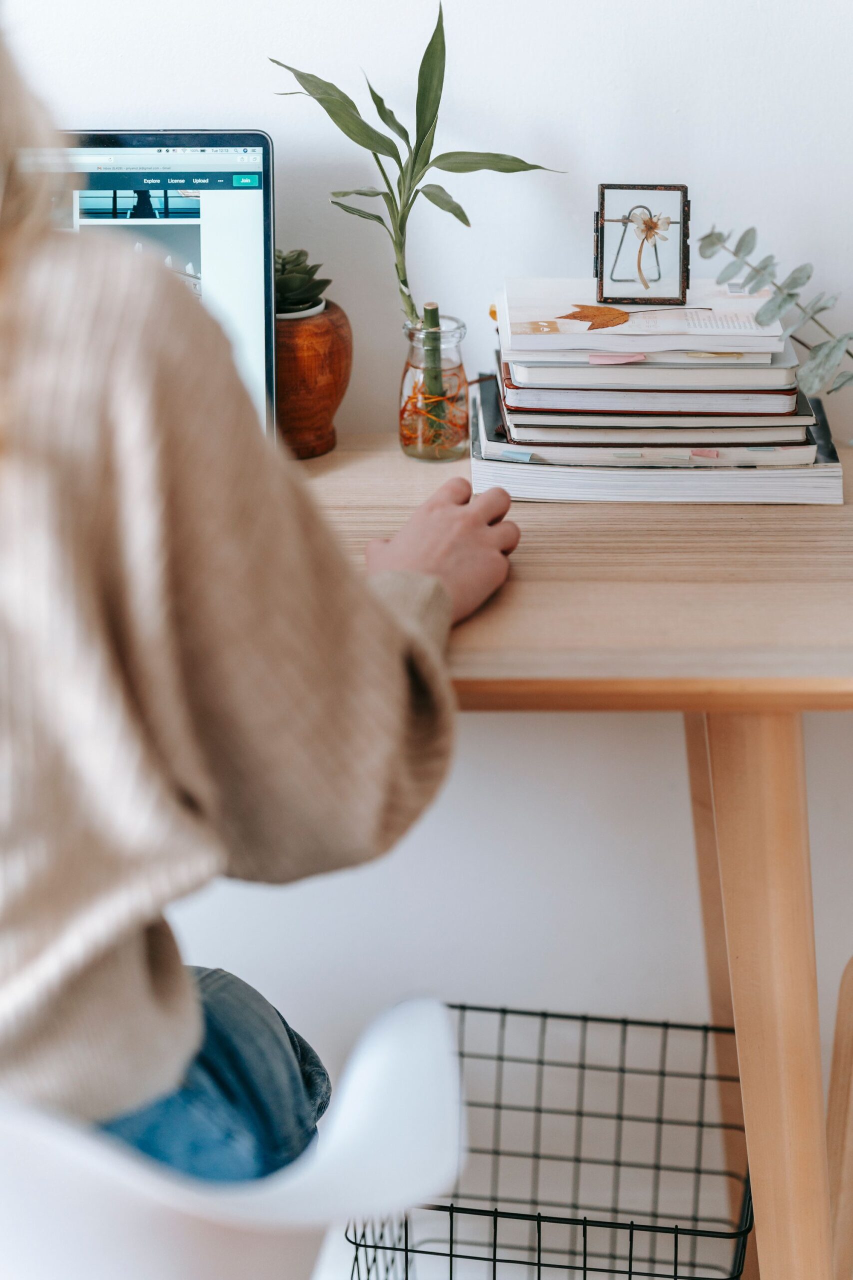 Illustrative photo of a freelancer working on a laptop at a home desk, representing freelance work on platforms like Upwork or Fiverr