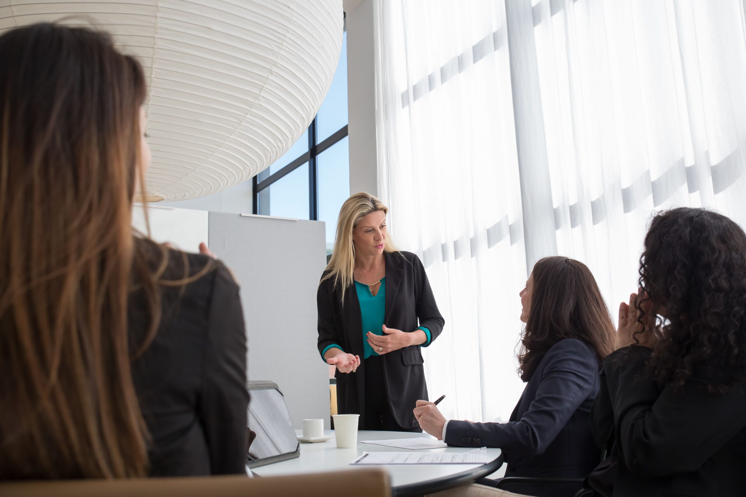 Illustrative photo of a business team presentation, representing pyramid scheme recruitment meetings