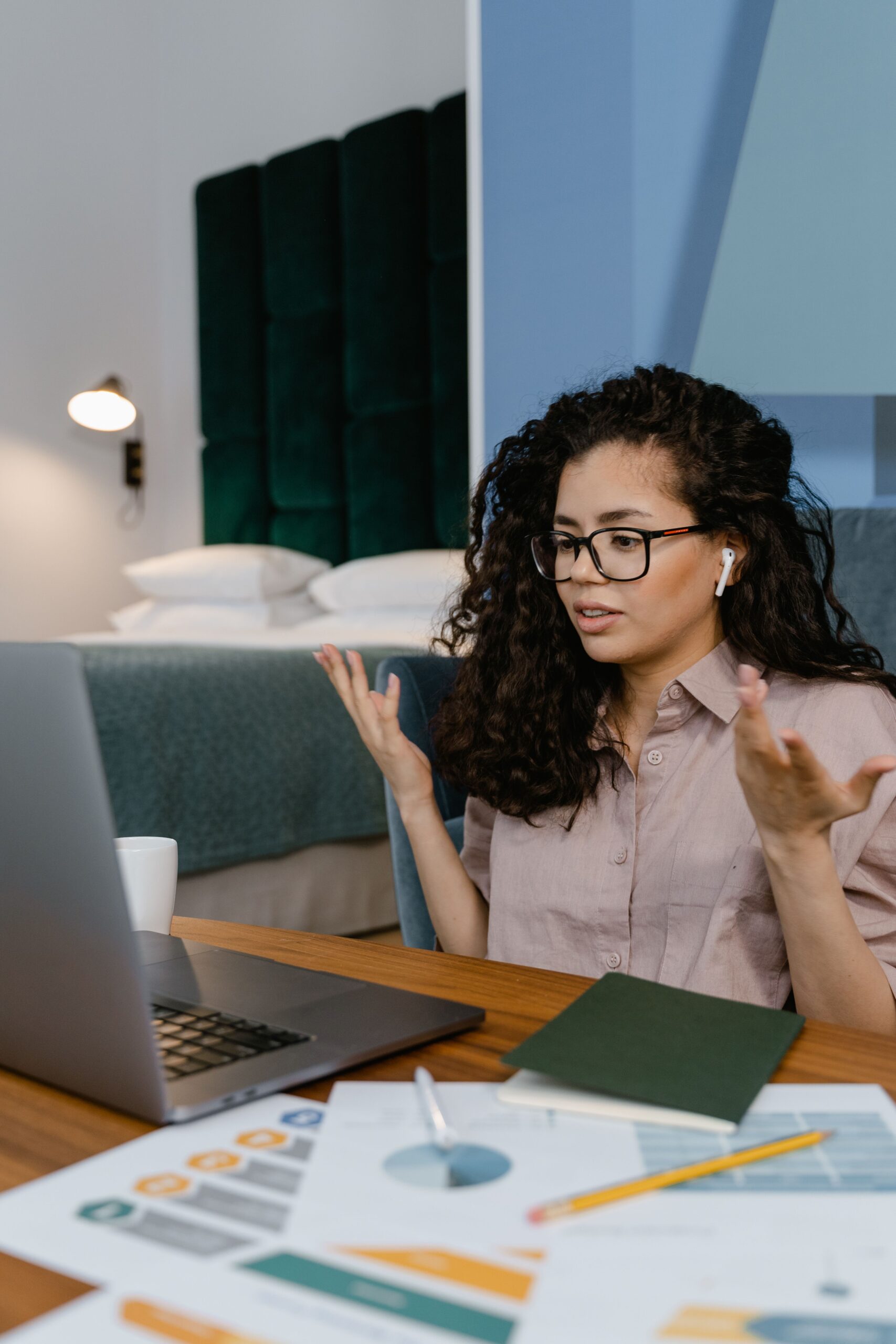 Illustrative photo of a woman on a video call at a laptop, representing virtual assistant hiring