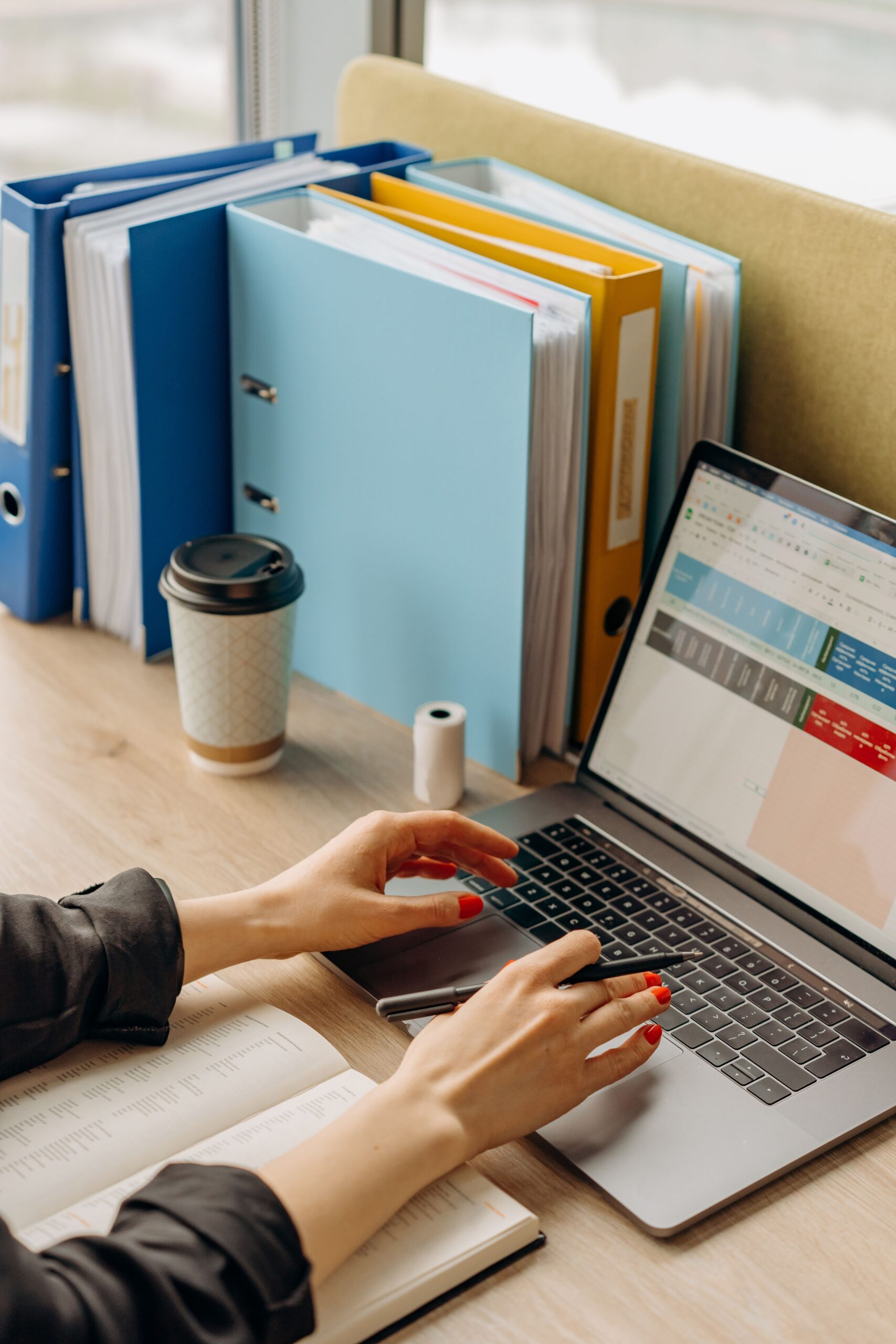 Illustrative photo of hands typing on a laptop, representing a digital product reseller license purchase